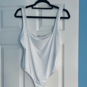 Never worn white sleeveless bodysuit